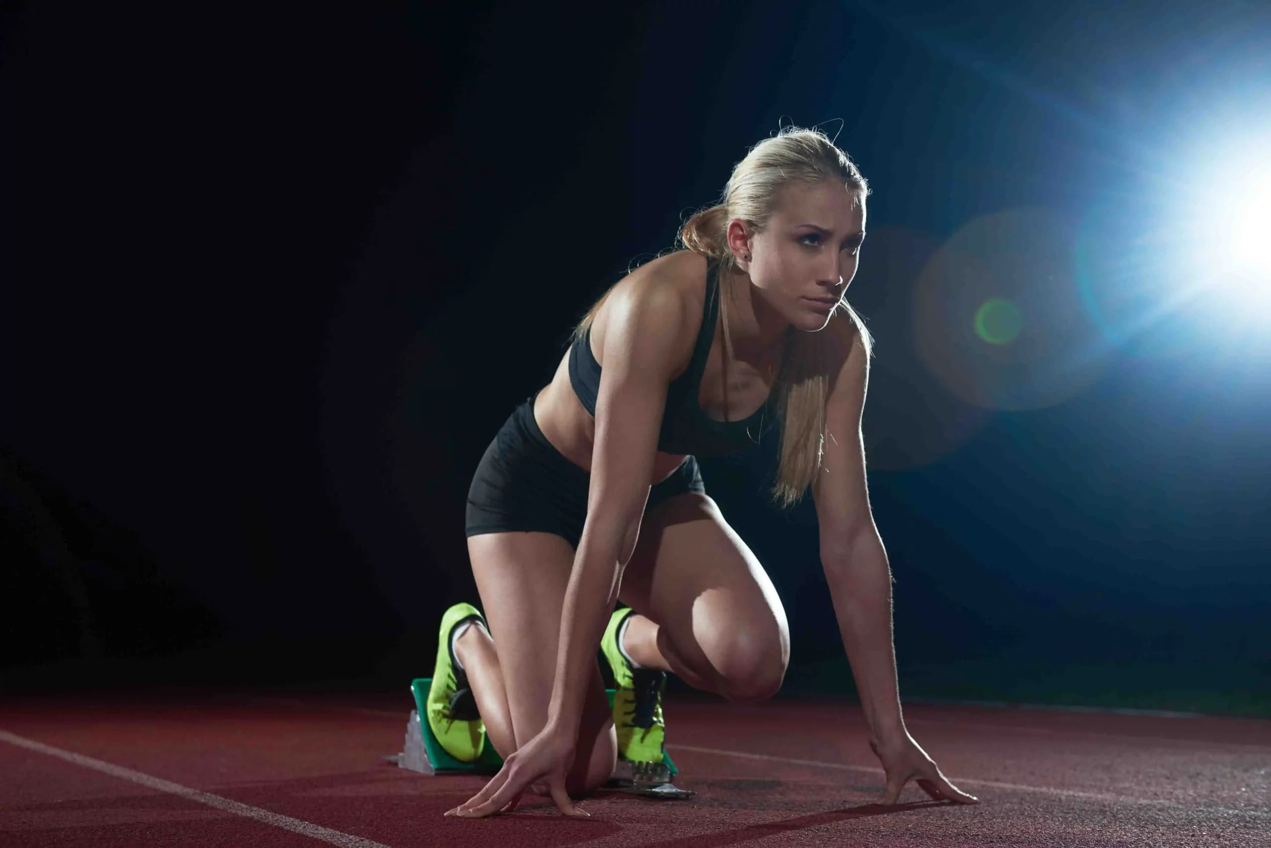Track Athlete preparing in Starting Blocks